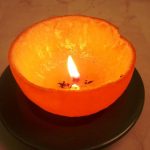 Aprenda a fazer uma vela com a casca da laranja